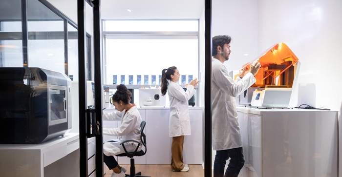Healthcare workers printing 3D models at a laboratory stock photo