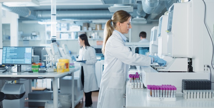 Biomedical Scientists Testing Out Clinical Specimens in a Clinical Laboratory 